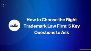 Blue background with white text that reads, How to Choose the Right Trademark Law Firm: 5 Key Questions to Ask. The word indie is inside a white circle on the left side.