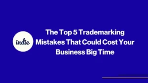 A blue background with white text that reads, The Top 5 Trademarking Mistakes That Could Cost Your Business Big Time, and a white circle on the left with indie written inside. Thin yellow and black lines are at the bottom right.