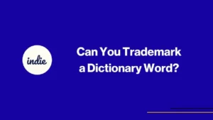 Blue background with white text that reads, “Can You Trademark a Dictionary Word?” Next to the text is a white circle with the word “indie” in lowercase cursive font.