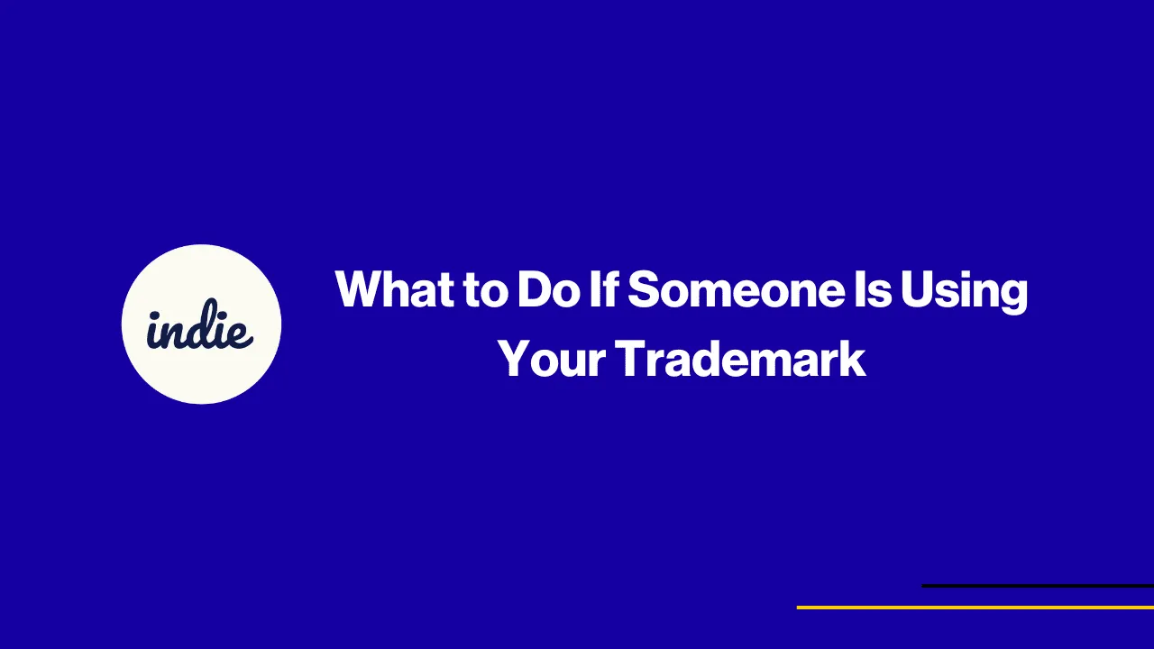 Blue background with a white circle on the left containing the word indie. Centered white text reads What to Do If Someone Is Using Your Trademark. Thin yellow and purple lines in bottom right corner.