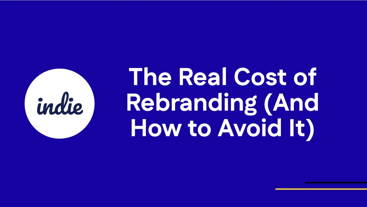 A blue background with the word indie in a white circle on the left and the text The Real Cost of Rebranding (And How to Avoid It) in bold white letters on the right. Thin yellow lines are in the bottom right corner.