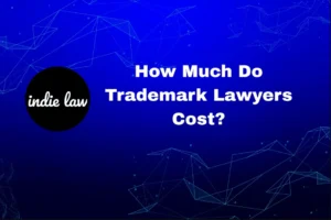 Blue background with abstract lines, "indie law" logo on the left, and white text that reads: "How Much Do Trademark Lawyers Cost?.