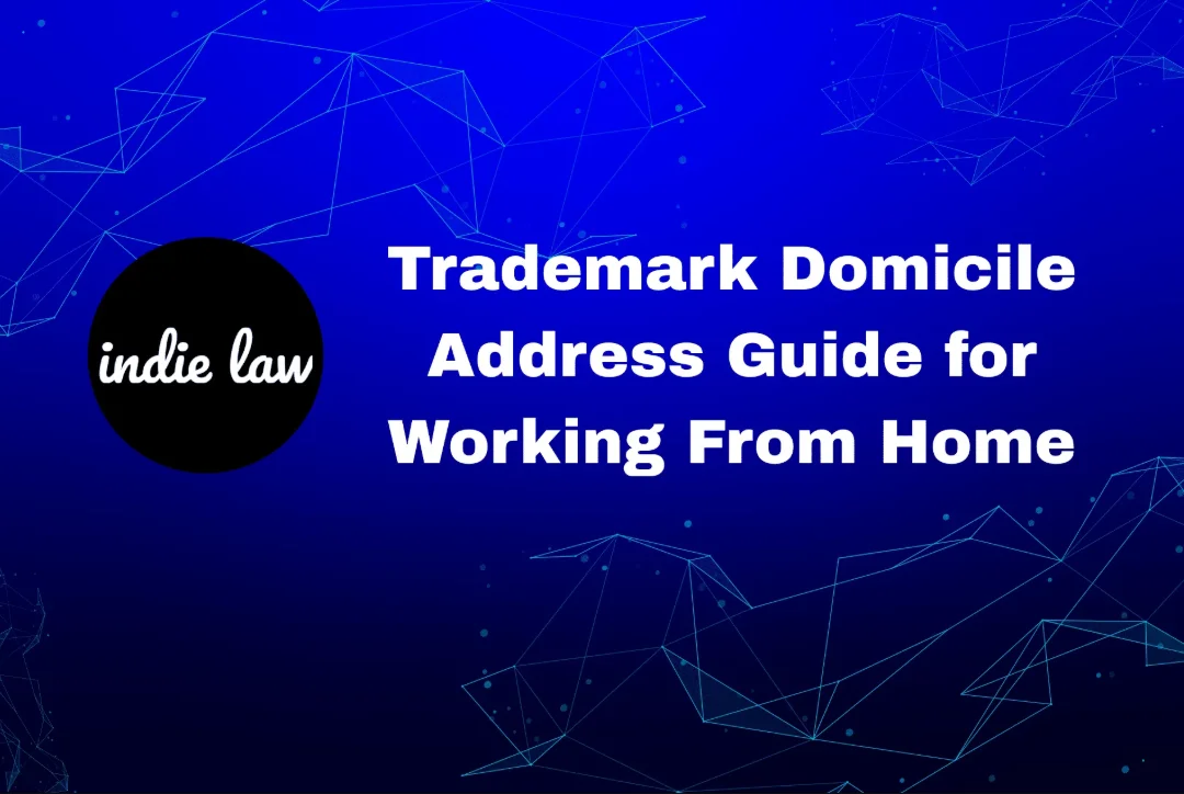 Blue graphic with white text reading "Trademark Domicile Address Guide for Working From Home" and a black circle logo with "indie law" in white. Geometric line patterns highlight the focus on Trademark Domicile Address rules.