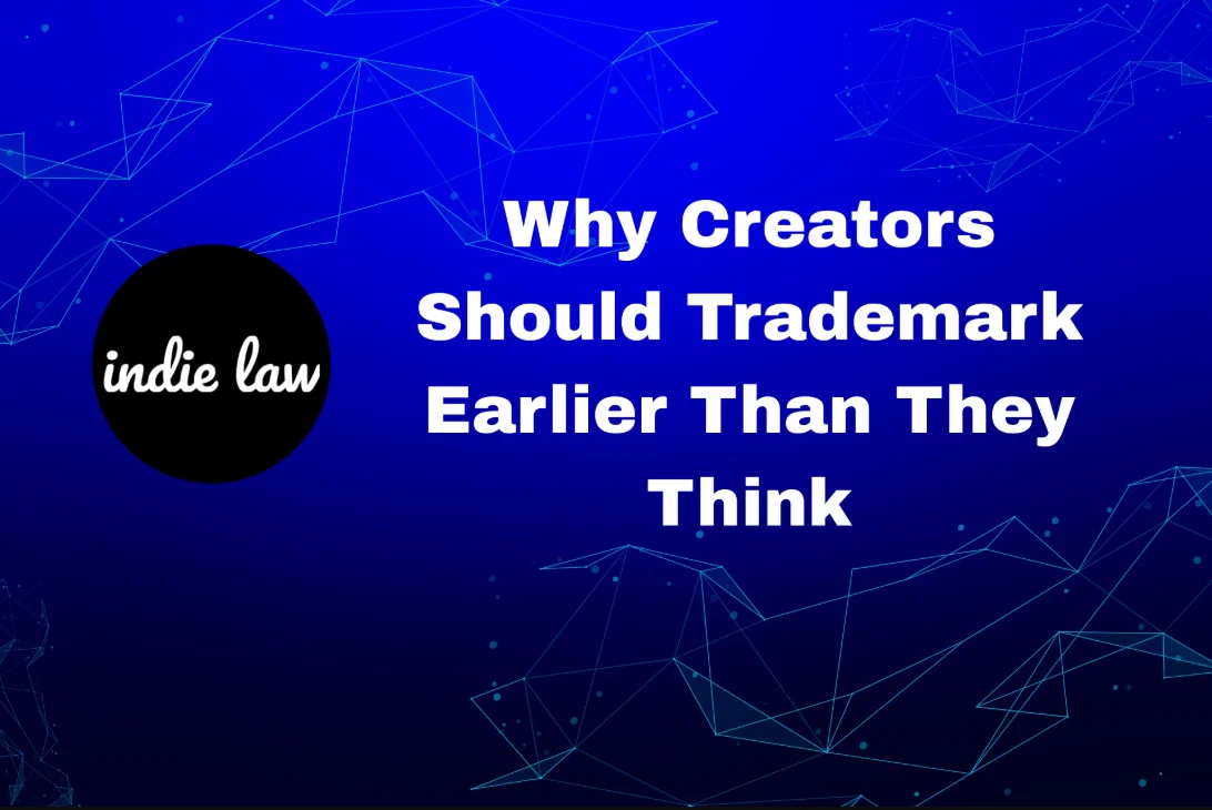 A blue background with geometric lines, the indie law logo on the left, and the text "Why Creators Should Trademark Earlier Than They Think" on the right.