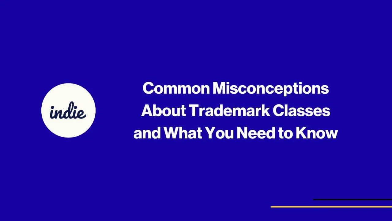 Dark blue background with white text: Common Misconceptions About Trademark Classes and What You Need to Know. A white circle on the left contains the word indie in lowercase. Thin yellow and purple lines at the bottom right.