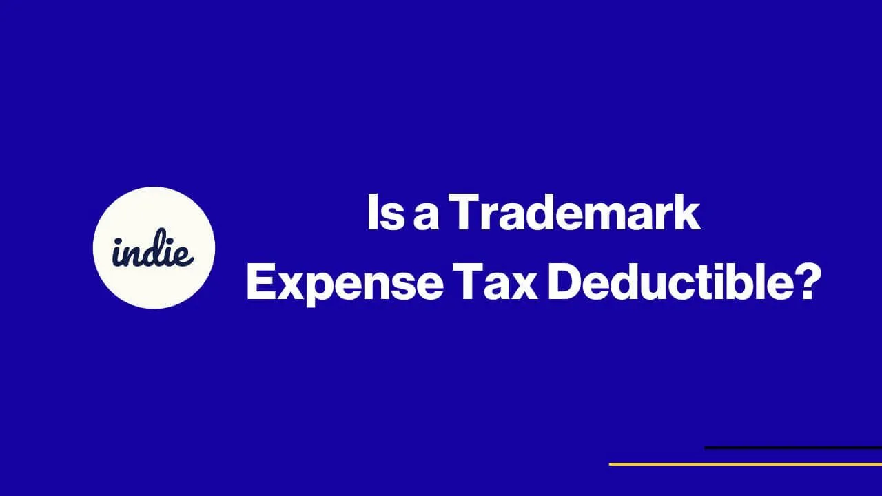 Blue background with white text that reads: Is a Trademark Expense Tax Deductible? and a white circle on the left with the word indie inside. There are two thin yellow lines in the bottom right corner.