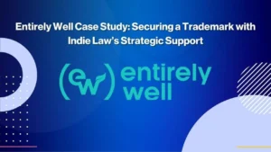 Blue background with white text that reads Entirely Well Case Study: Securing a Trademark with Indie Law’s Strategic Support. The entirely well logo is in teal in the center. Geometric shapes decorate the corners.