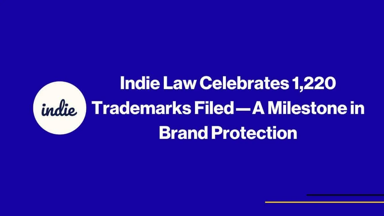 Image with a blue background featuring the text: Indie Law Celebrates 1,220 Trademarks Filed—A Milestone in Brand Protection. A white circle with the word indie is on the left. Thin yellow and purple lines are at the bottom right.